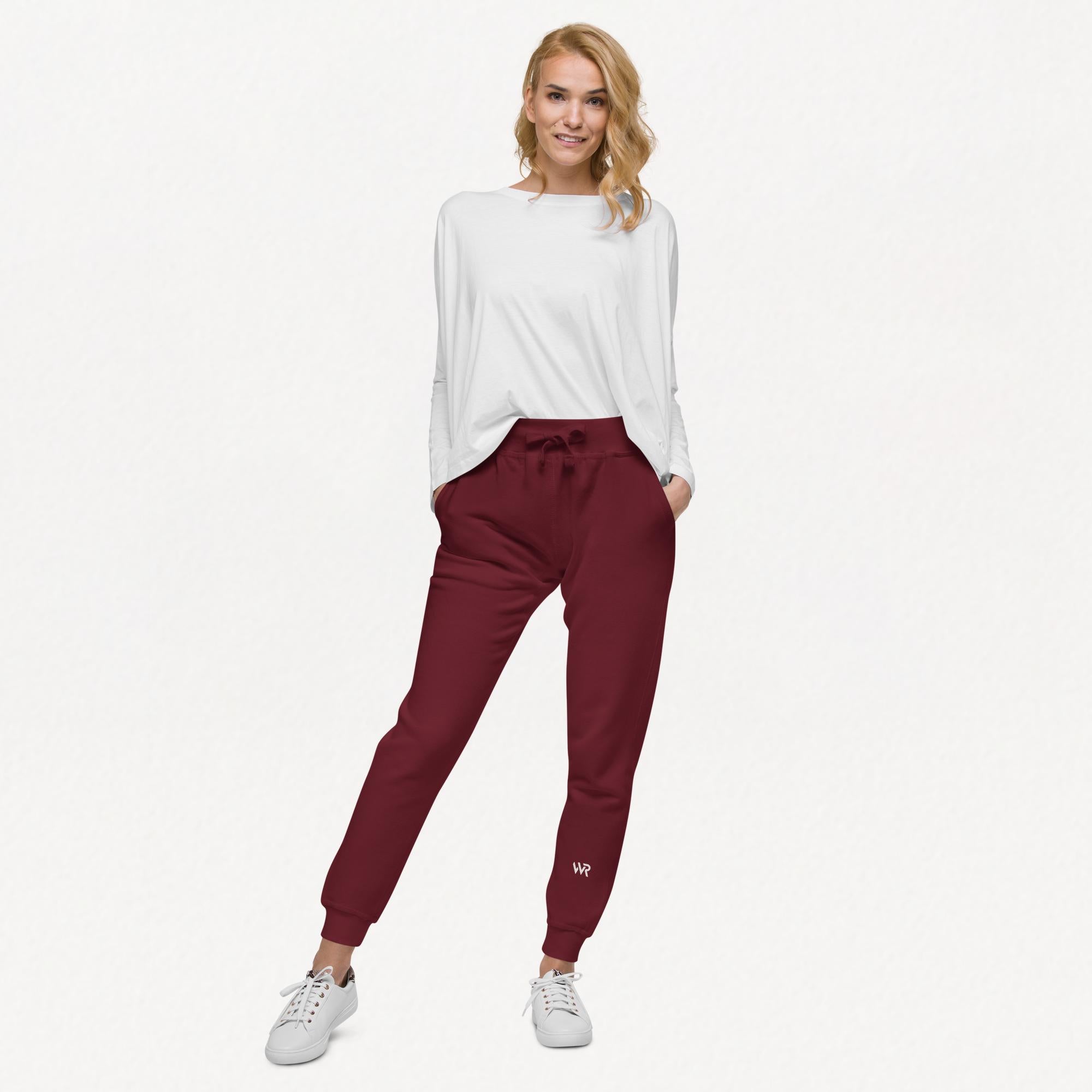 Women's essential slim fit sweatpants in maroon, front view.