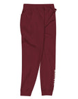 Women's essential slim fit sweatpants in maroon, side view.