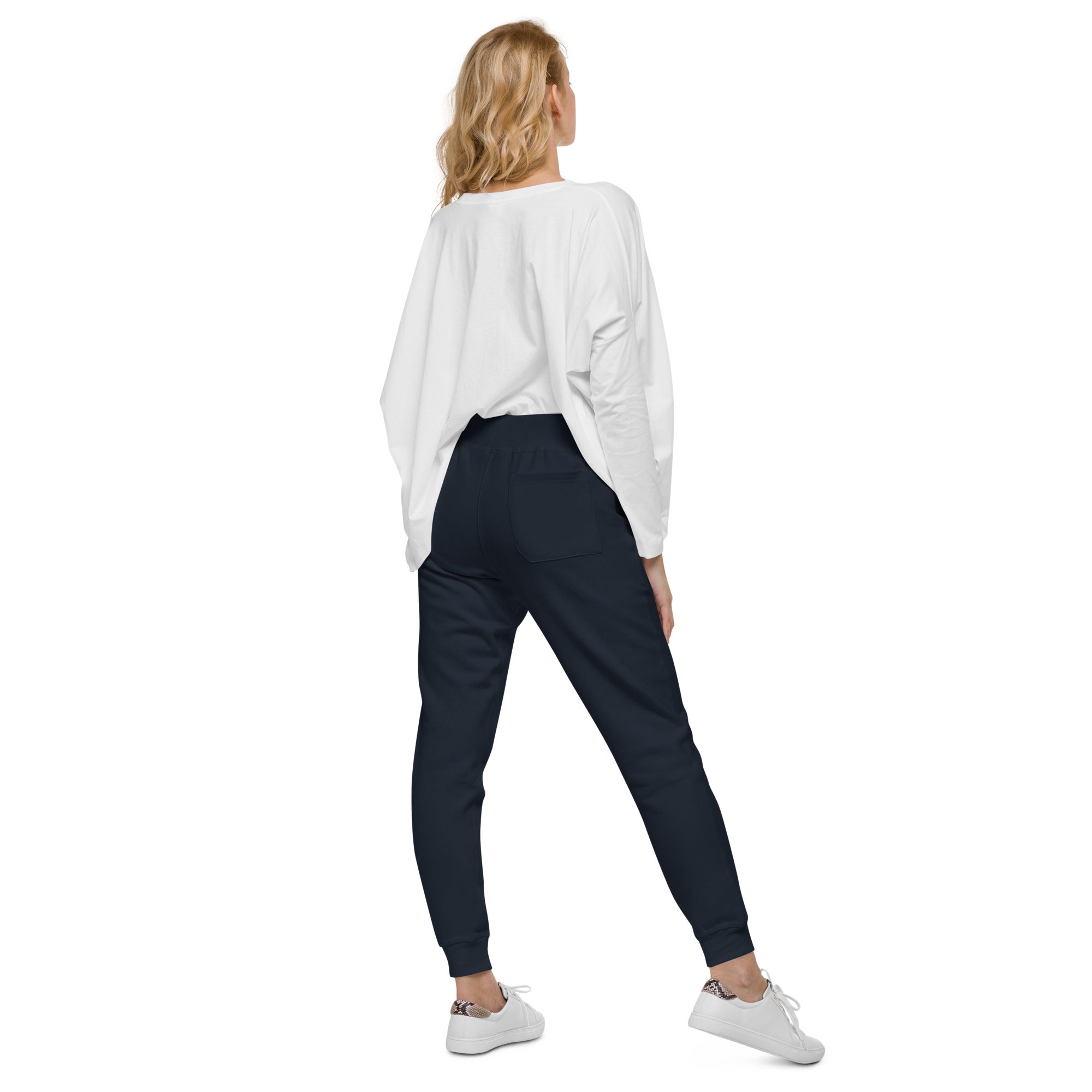 Women's essential slim fit sweatpants in dark blue, back view.