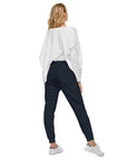 Women's essential slim fit sweatpants in dark blue, back view.