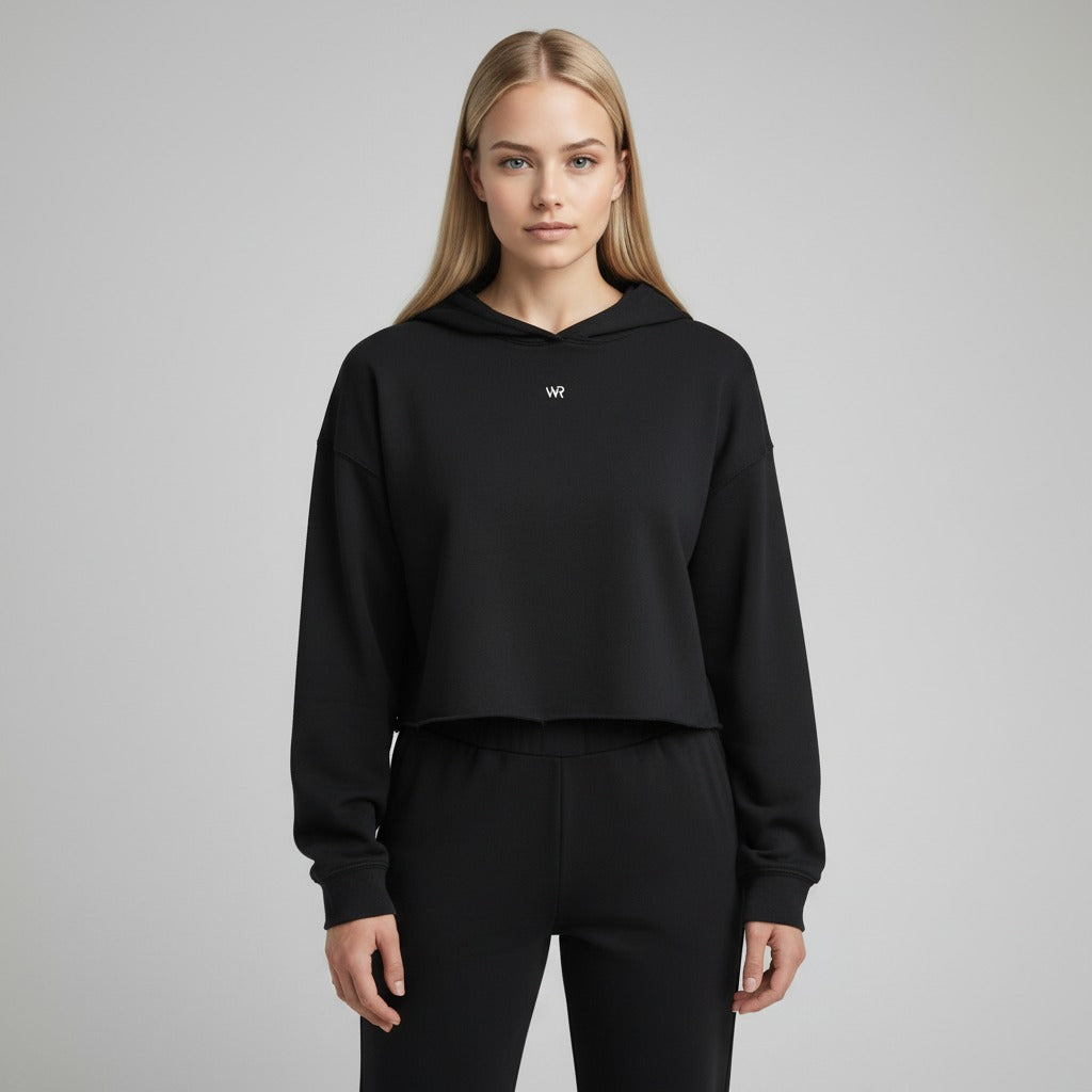 Women's cropped hoodie in black with "WR" text, front view.