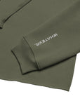 Women's cropped hoodie in green with "WHATEVR" text, side view.