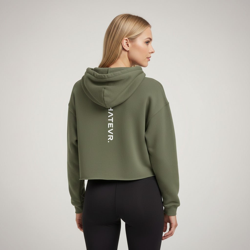 Women's cropped hoodie in green with "WHATEVR" text, back view.
