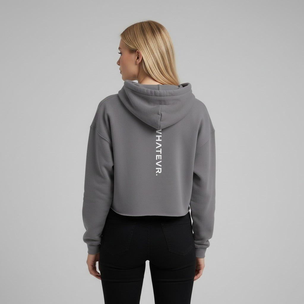 Women's cropped hoodie in grey with "WHATEVR" text, back view.