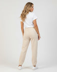 Women's premium heavyweight sweatpants in beige, back view