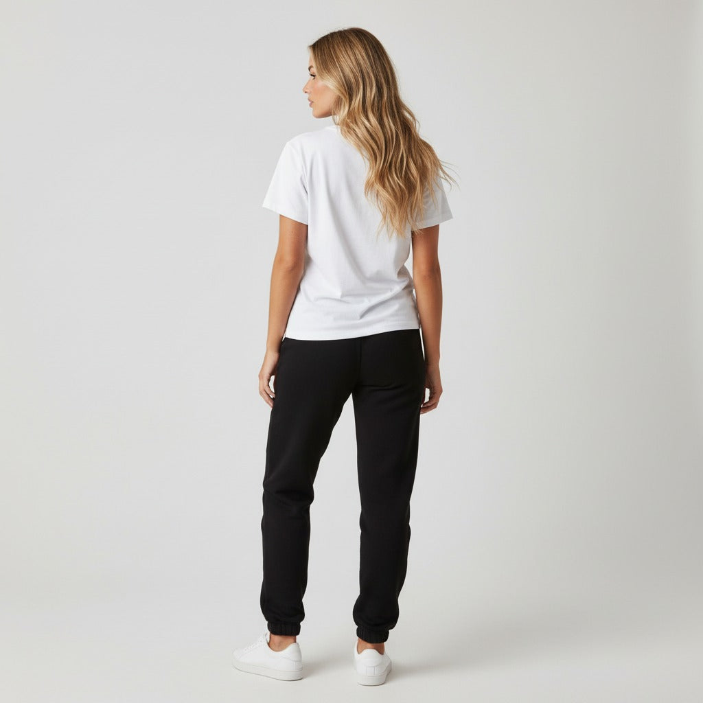 Women's premium heavyweight sweatpants in black, back view.