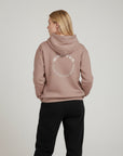 Women's premium heavyweight hoodie in taupe with "Confidence Worn" text, back view.