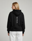 Women's premium heavyweight hoodie in black with "WHATEVR" text, back view.