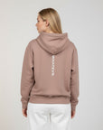 Women's premium heavyweight hoodie in taupe with "WHATEVR" text, back view.