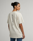 Women's premium heavyweight oversized t-shirt in beige, back view
